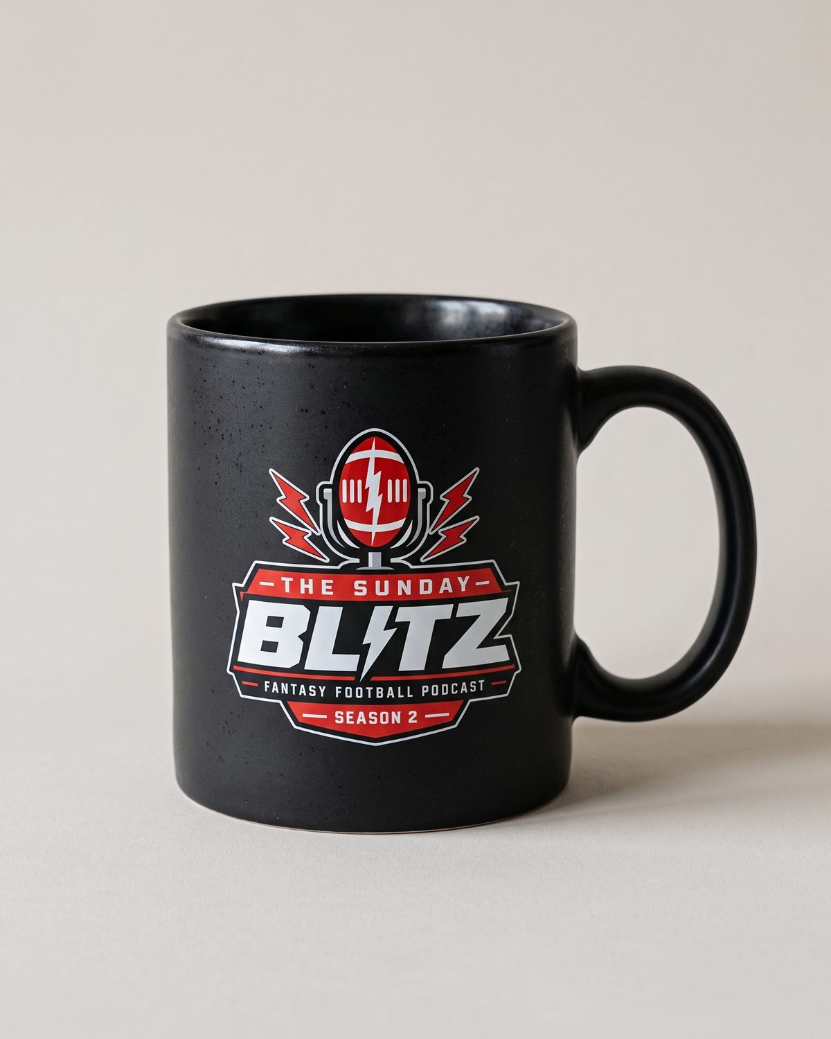 Matte black Sunday Morning Mug with the Season 2 crest
